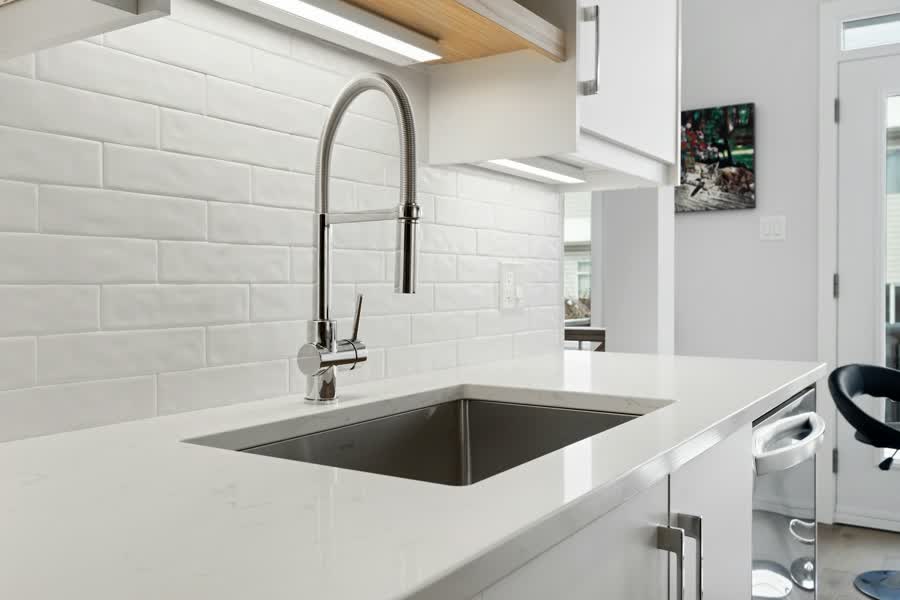 Modern kitchen sink with a tall faucet