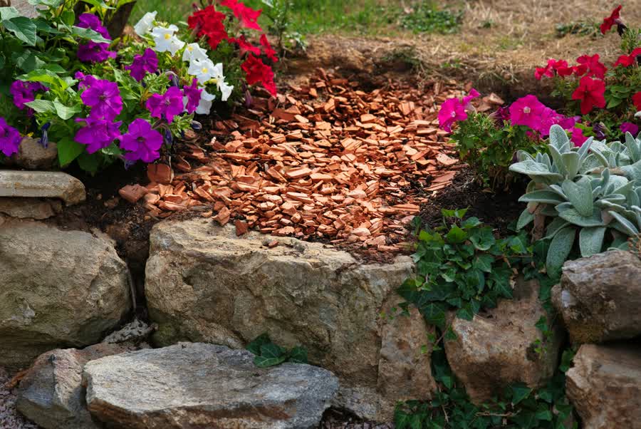 Flower bed with fresh mulch and stone edging